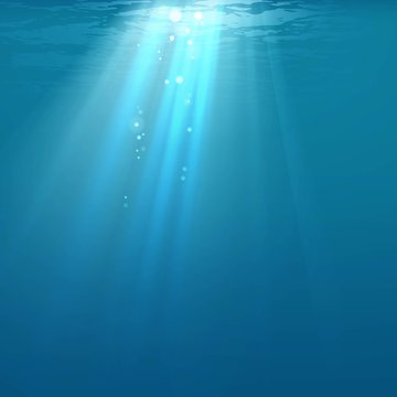 Light in water. Rays of light against the background of water