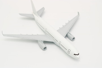 Miniature passenger airplane on white isolated background.