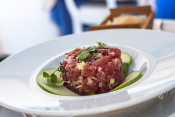 A plate of delicious tuna tartare with green apple