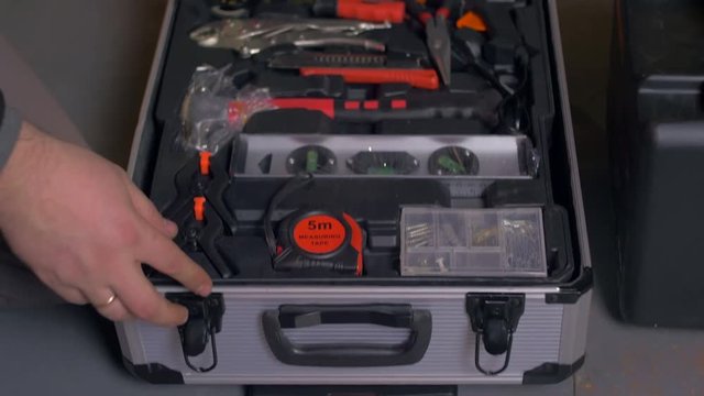Opening a box with tools