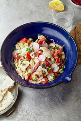 Overhead image of traditional jewish and middle eastern dish fattoush. Israeli cuisine concept