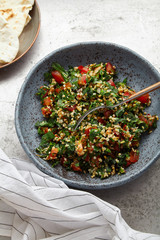 Overhead image of traditional jewish and middle eastern dish tabouli. Israeli cuisine concept