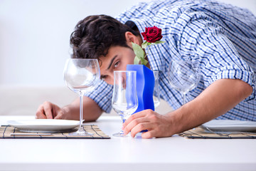 Man alone preparing for romantic date with his sweetheart