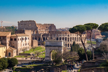 Titus Arch and the Roman Colosseum in Rome, Italy as seen from the Palatine Hill