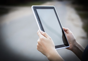 people and technology .closeup of person holding digital tablet