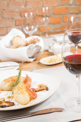 Traditional polish dish called kartacz - potato dumplings stuffed with meat and served with crispy bacon, caramelized onion and fried boletu