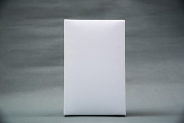 Empty Package white cardboard box or tray  for product on grey background.