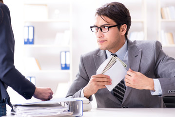 Businessmanbeing offered bribe for breaking law