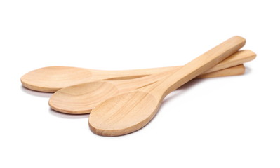 Empty wooden spoons isolated on white background