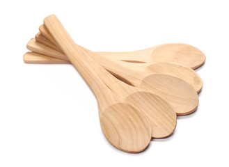 Empty wooden spoons isolated on white background