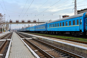 Fototapeta na wymiar Passenger and freight train. Passenger diesel train traveling speed railway wagons journey light