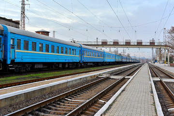 Obraz na płótnie Canvas Passenger and freight train. Passenger diesel train traveling speed railway wagons journey light