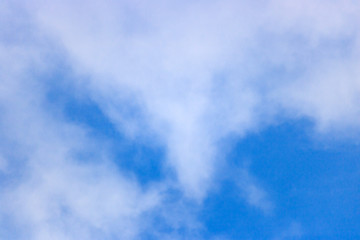 Soft white clouds against blue sky. Abstract sky background