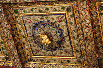 Lovely cupid at ceiling of  Wat Phra Kaew Don Tao, Lampang, Thailand.