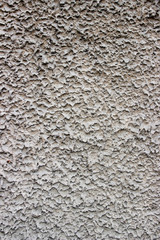 old textured wall of a house of concrete