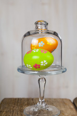 Easter eggs in a transparent glass dish