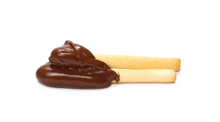 Bread sticks dipped, covered in creamy chocolate, isolated on white background