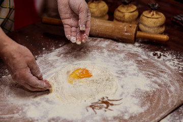 Female hands making dough for pizza. Making bread. Cooking Process Concept