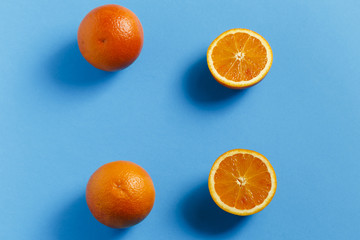 Oranges isolated on blue background