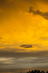 The sky after a summer thunderstorm. Orange cumulus clouds. Sunset. .Thunder Sky