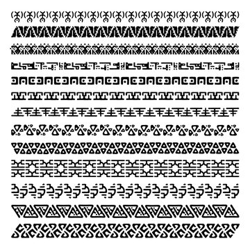 Vector set of 13 decorative geometric seamless borders in ethnic style. Collection of pattern brushes for frames. Aztec tribal ornaments. Freehand drawing. Black and white.