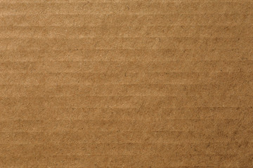 Fototapeta na wymiar Cardboard sheet of brown paper, abstract texture background