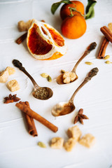 Celebrate new year winter evening with hot drink. Mulled wine or grog ingredients. White background top view. Space for text