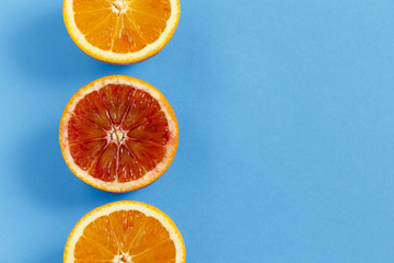 Oranges isolated on blue background