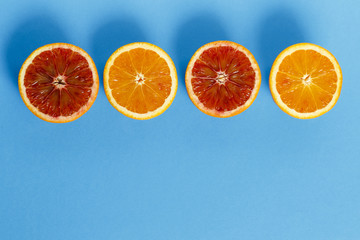 Oranges isolated on blue background