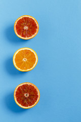 Oranges isolated on blue background