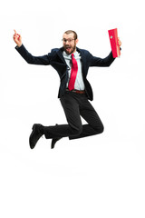 Funny cheerful businessman jumping in air over white background