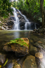 Naklejka na ściany i meble scenery of tropical forest waterfall