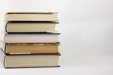 A stack of books on a white background.