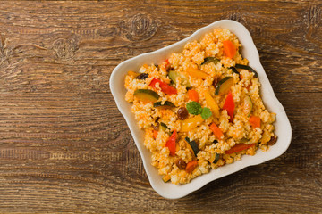 Millet with vegetables and raisins.