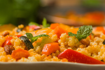 Millet with vegetables and raisins.