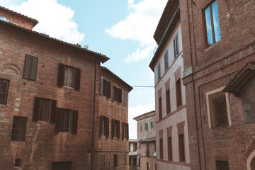 Fototapeta na wymiar Tuscany architectural buildings on street in Siena
