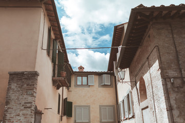 Fototapeta na wymiar Old houses in historical quarter of Siena