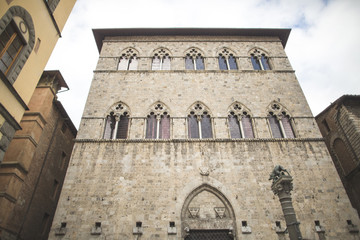 Windows in Gothic style on old building in Siena