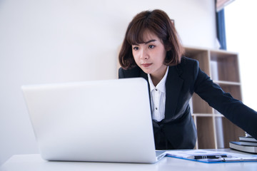 Naklejka premium New generation asian teenage girl happy face looking laptop.