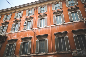 Fototapeta na wymiar Red building facade in historical quarter of Rome