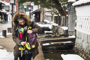 Tourist girl Explore the beauty of the city of tsuwano in winter.