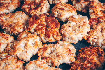 Cooking in a frying pan, fry chicken cutlets