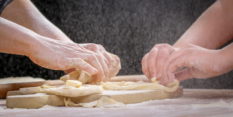 Making dough by female hands at home in kitchen