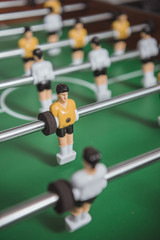 close up of table soccer with football players silhouettes