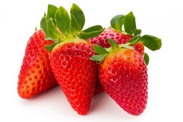 Fresh strawberries close up on white background.