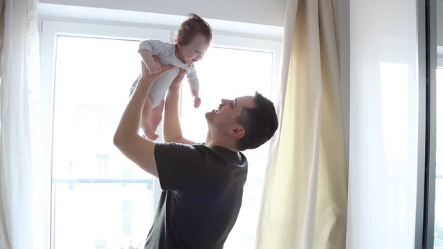 Father nad son have a fun together at home