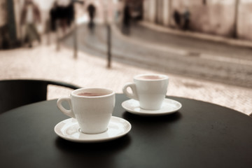 Coffee cup on table in cafe.