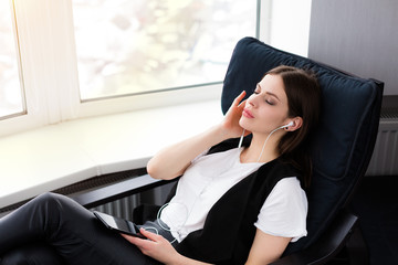 Beautiful woman sitting by the window