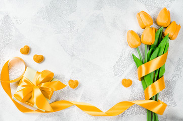 Holiday background with tulips and gift box