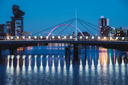 Night cityscape with two bridges on the river Clyde, Millennium Bridge and The Clyde Arc, Glasgow, Scotland